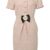 Blush cotton-blend bouclé tweed short sleeve half-button sheath dress with contrasting floral bow appliqué at centre front