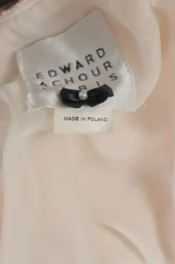 Blush cotton-blend bouclé tweed short sleeve half-button sheath dress with contrasting floral bow appliqué at centre front