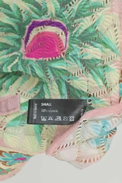Blush polyamide pointelle knit tie-neck cap sleeve top featuring multi-coloured floral motif