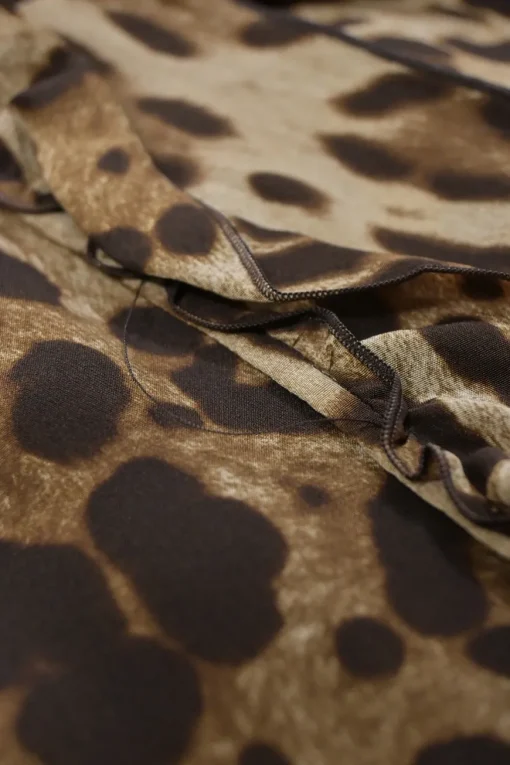 Brown leopard print half-button pullover sleeveless top with ruffled neckline