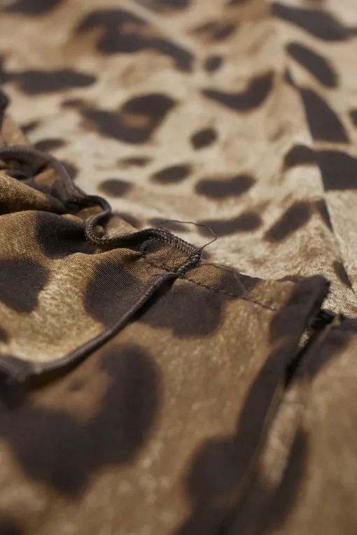 Brown leopard print half-button pullover sleeveless top with ruffled neckline