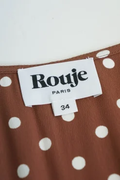 Brown rayon polka dot Naomi dress with gathered bodice, cinched waist, and pencil skirt
