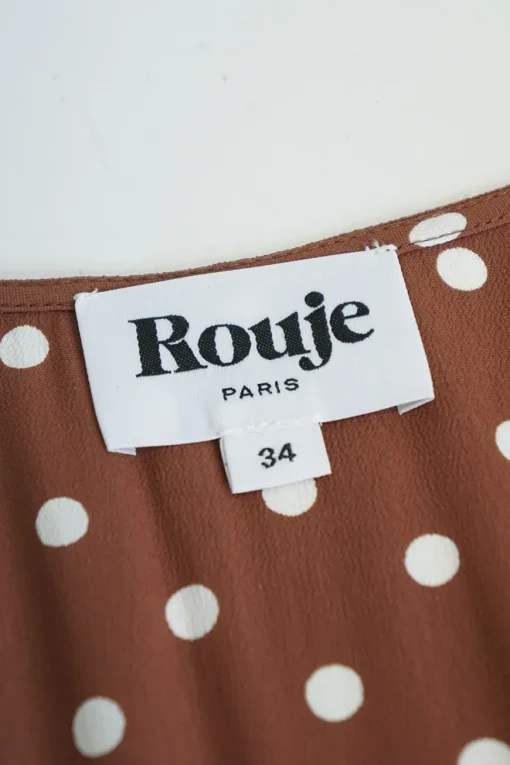 Brown rayon polka dot Naomi dress with gathered bodice, cinched waist, and pencil skirt