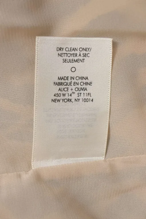 Brown silk leopard print mock neck tulip-back bubble blouse with ribbon-tie fastening at nape