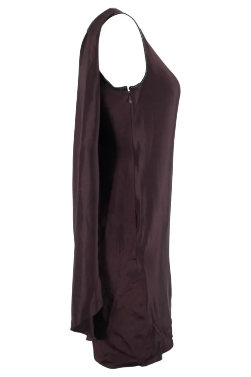 Brown sleeveless single shoulder silk mini dress with overlapping front and leather binding on the neckline and armhole