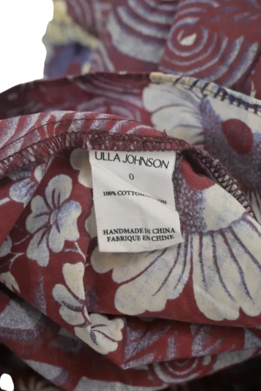 Burgundy cotton floral print ruffle keyhole-front swing-style blouse with button loop fastening at centre front