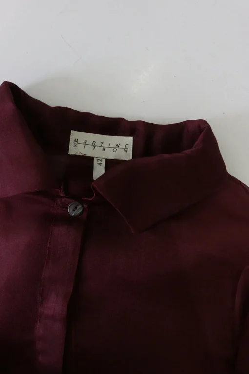 Burgundy silk organza button-front shirt with tiered ruffle sleeves and draped back panels
