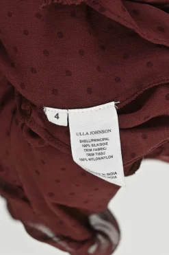 Burgundy silk semi-sheer polka dot keyhole ruffle blouse with tassel tie fastening at centre front