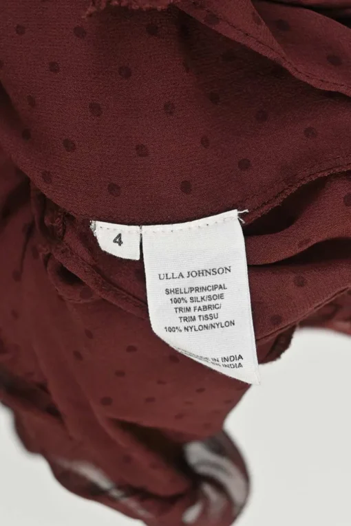 Burgundy silk semi-sheer polka dot keyhole ruffle blouse with tassel tie fastening at centre front