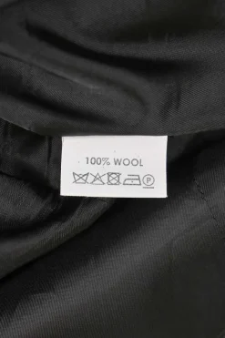 Charcoal draped bias-cut stripe wool sleeveless sheath dress with cascade drape hip detail