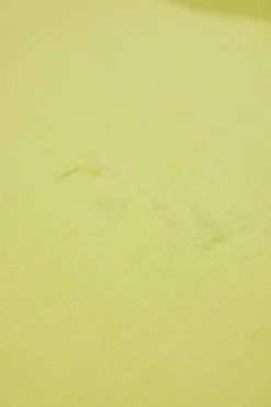 Chartreuse lace-trimmed Tencel-blend jersey knit slip dress with tuck-pleat hip detail