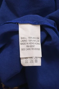 Cobalt blue shirred nylon mock neck long sleeve blouse featuring abstract motif