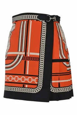 Coral and black silk chainlink foulard print apron-style pleated mini skirt with horsebit-trimmed waist