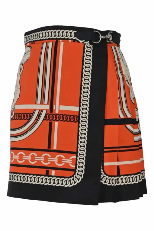 Coral and black silk chainlink foulard print apron-style pleated mini skirt with horsebit-trimmed waist
