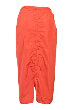 Coral red polyester pull-on slit-back ruched godet midi skirt