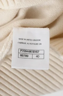 Cream and black cashmere-silk blend crewneck intarsia knit sweater featuring floral Coco Mark sleeve motif