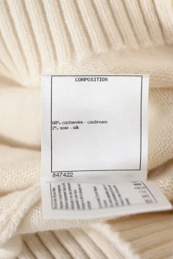 Cream and black cashmere-silk blend crewneck intarsia knit sweater featuring floral Coco Mark sleeve motif