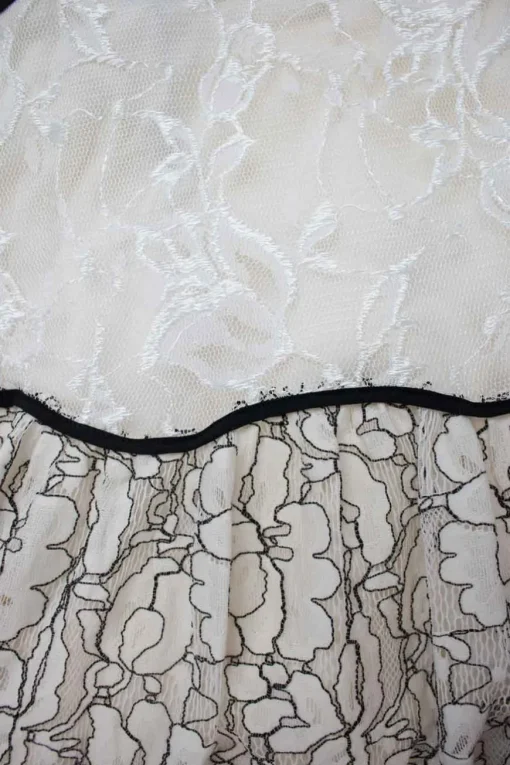 Cream and black long sleeve lace maxi dress with open back and back tie straps