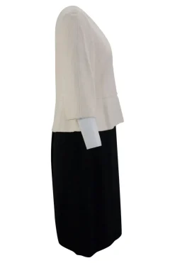 Cream and black wool layered mid-sleeve knee-length dress. feature zipper fastening at the back.