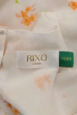 Cream and orange rayon abstract floral print smocked half-sleeve tiered maxi dress with self-tie cutout back