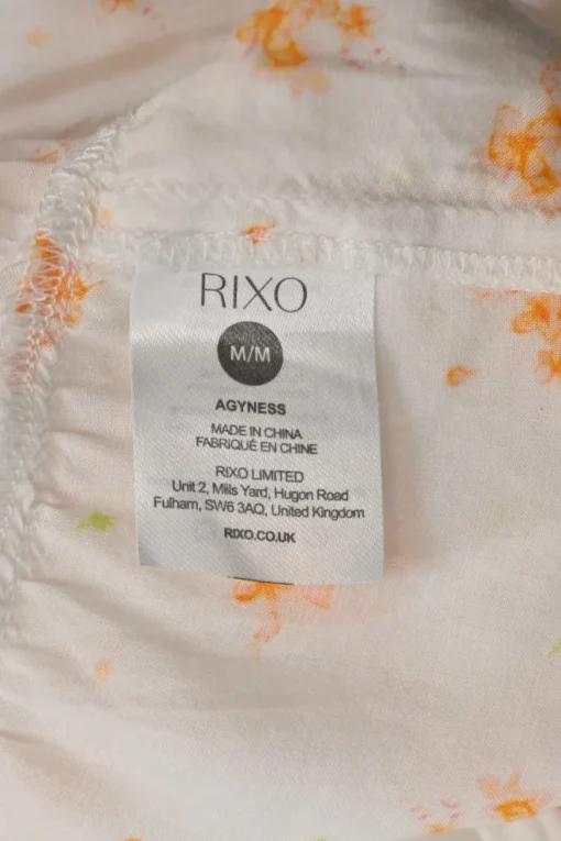 Cream and orange rayon abstract floral print smocked half-sleeve tiered maxi dress with self-tie cutout back