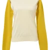Cream and yellow convertible crewneck sweater with detachable sleeves