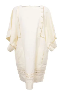 Cream bias-cut paneled linen-blend tunic shift featuring bateau neck, kimono sleeves, and cutout edge trim appliqué