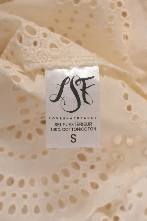 Cream cotton broderie Anglaise button-back long sleeve ruffled blouse