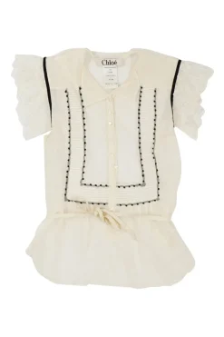 Cream cotton-silk plumette tulle spread collar pullover button-front tie-waist peplum top with flutter sleeves