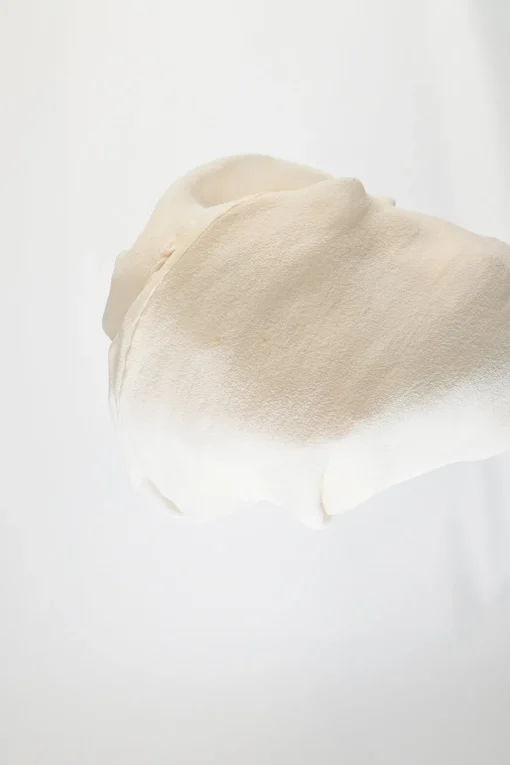 Cream semi-sheer silk cowl-neck tunic top with tonal frill trim