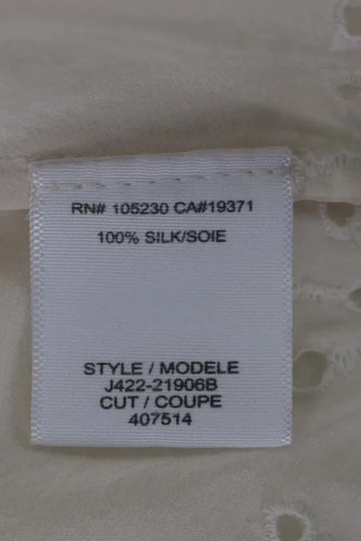 Cream sleeveless silk top with broderie hem