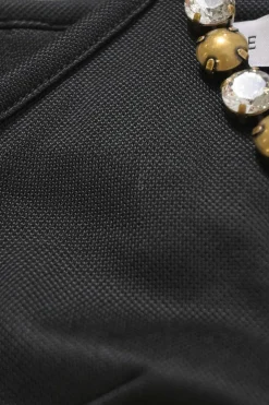 Crystal-embellished black viscose-blend heart cutout halter-neck bustier top