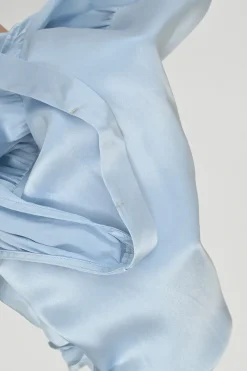 Dusty blue silk empire-waist slip dress with gathered bodice and fixed straps