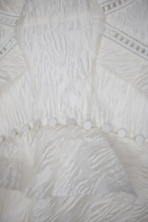 Ecru cami strap pattern dress with white lace band embellishment and peplum