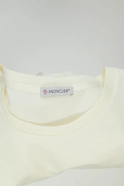 Ecru cotton and polyester mixed-media crewneck pullover T-shirt with lace insert and toggle hem