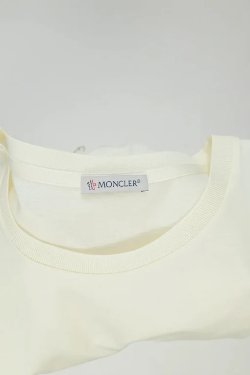 Ecru cotton and polyester mixed-media crewneck pullover T-shirt with lace insert and toggle hem