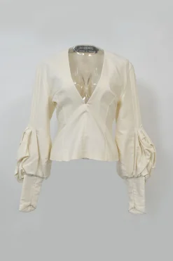 Ecru cotton plunge neck bishop sleeve blouse with frame-defining princess seams