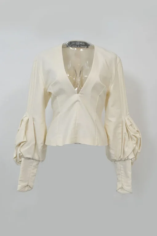 Ecru cotton plunge neck bishop sleeve blouse with frame-defining princess seams