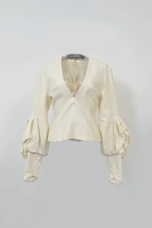 Ecru cotton plunge neck bishop sleeve blouse with frame-defining princess seams