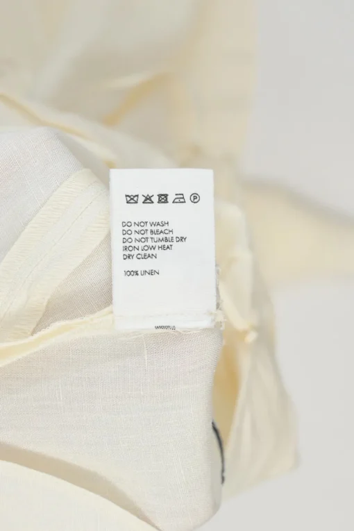 Ecru linen La Robe Camargue open-back godet slip bridal gown with stacked tie fastening at centre back
