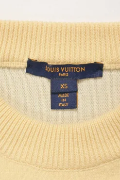Ecru wool-blend crewneck pullover sweater with zip cuffs and monogram flower binding detail