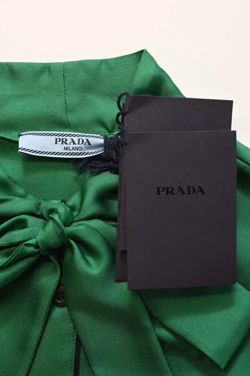 Emerald green silk satin button-front pussy-bow blouse with logo-embroidered chest patch pocket