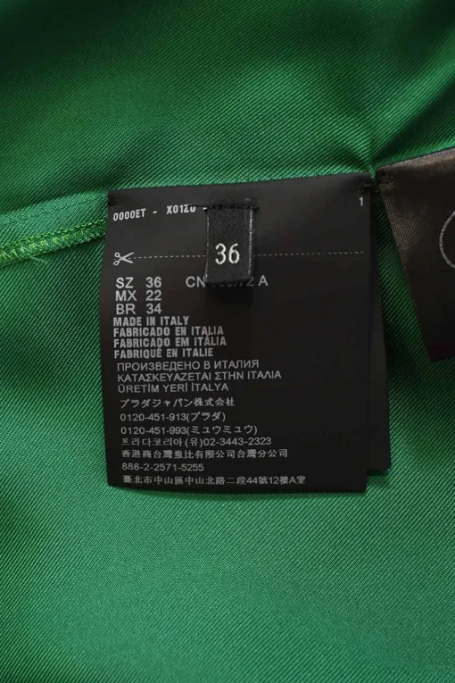 Emerald green silk satin button-front pussy-bow blouse with logo-embroidered chest patch pocket