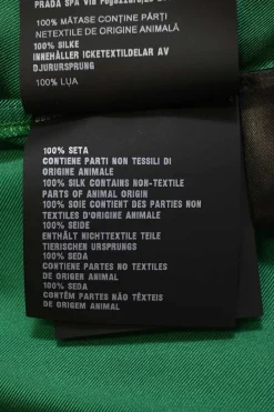 Emerald green silk satin button-front pussy-bow blouse with logo-embroidered chest patch pocket