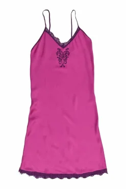 Fuchsia lace-trimmed silk slip dress featuring floral broderie motif at centre front