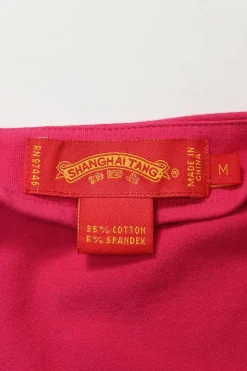 Fuchsia stretch-cotton jersey V-neck top with contrast broderie detailing and embellished cuffs