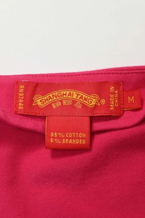 Fuchsia stretch-cotton jersey V-neck top with contrast broderie detailing and embellished cuffs