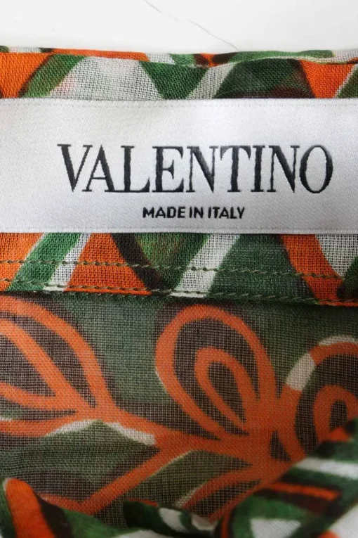 Green and orange cotton rhino print pullover swing-style classic collar half-button draped blouse