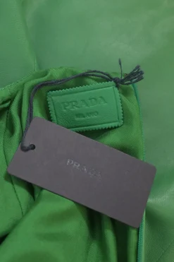 Green lambskin leather short sleeve top featuring logo-emblazoned chest patch pocket
