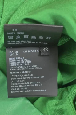 Green lambskin leather short sleeve top featuring logo-emblazoned chest patch pocket